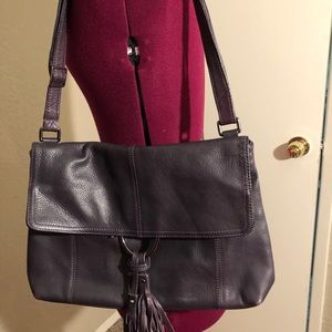 Alfani woman’s leather purple purse.